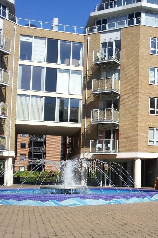 Modern block of flats with fountain
